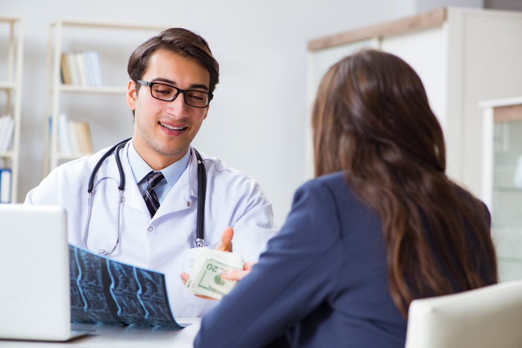 Doctor being offered a bribe.